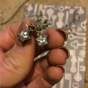 Sterling silver diamond star earrings.